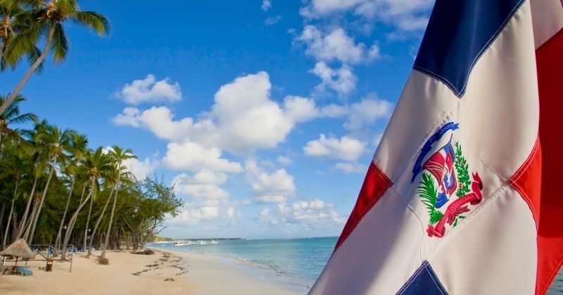 Dominican Republic beach and flag for shipping a loved one's remains from New Jersey to the Dominican Republic